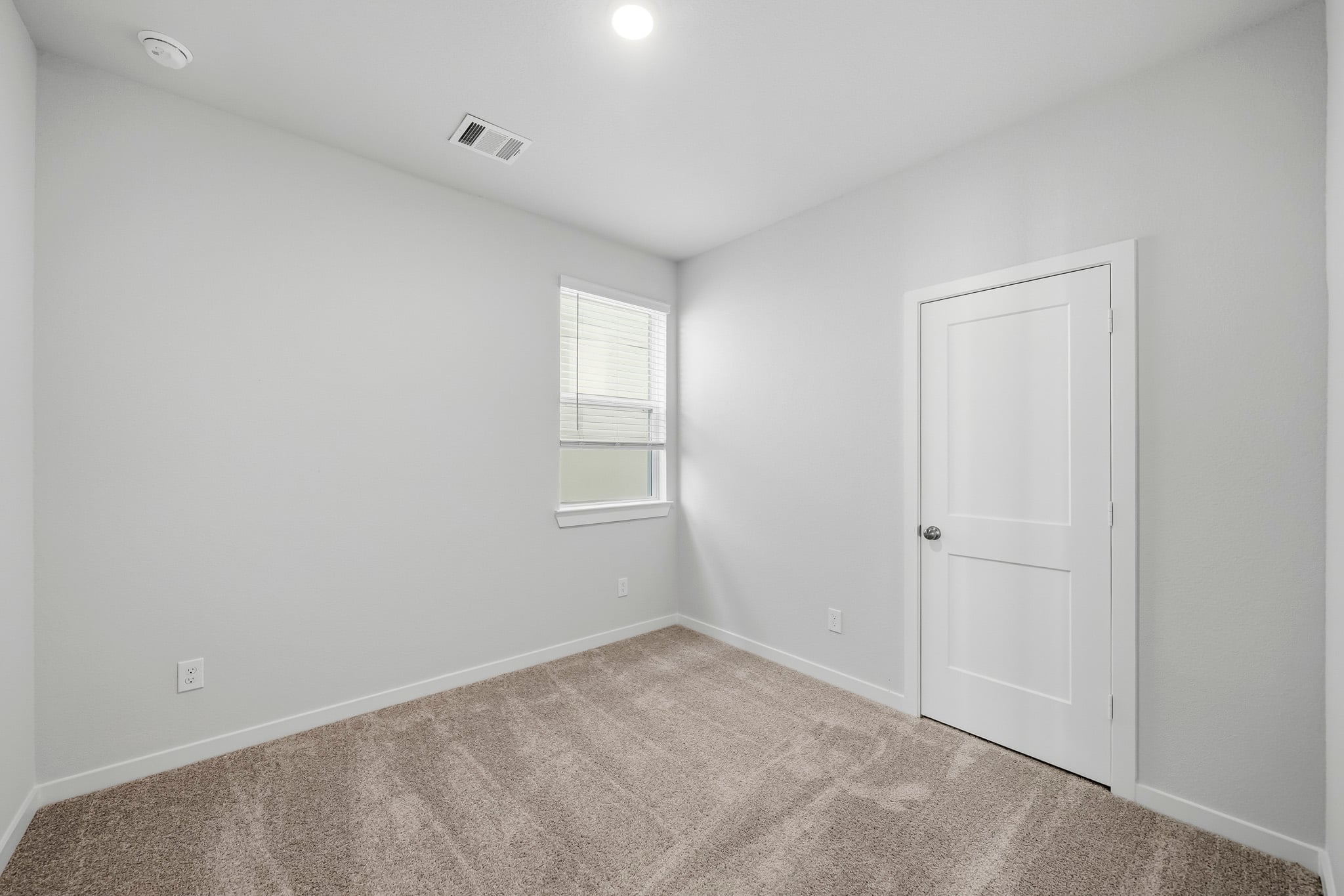 A room with a door and a window.