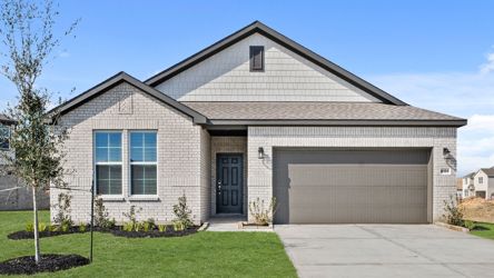 A house with a garage with American Gothic House in the background.