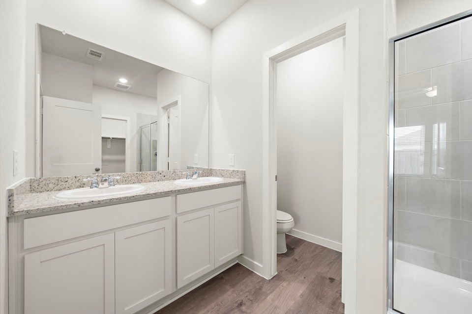 A bathroom with a glass shower.
