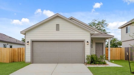 A house with a garage with American Gothic House in the background.