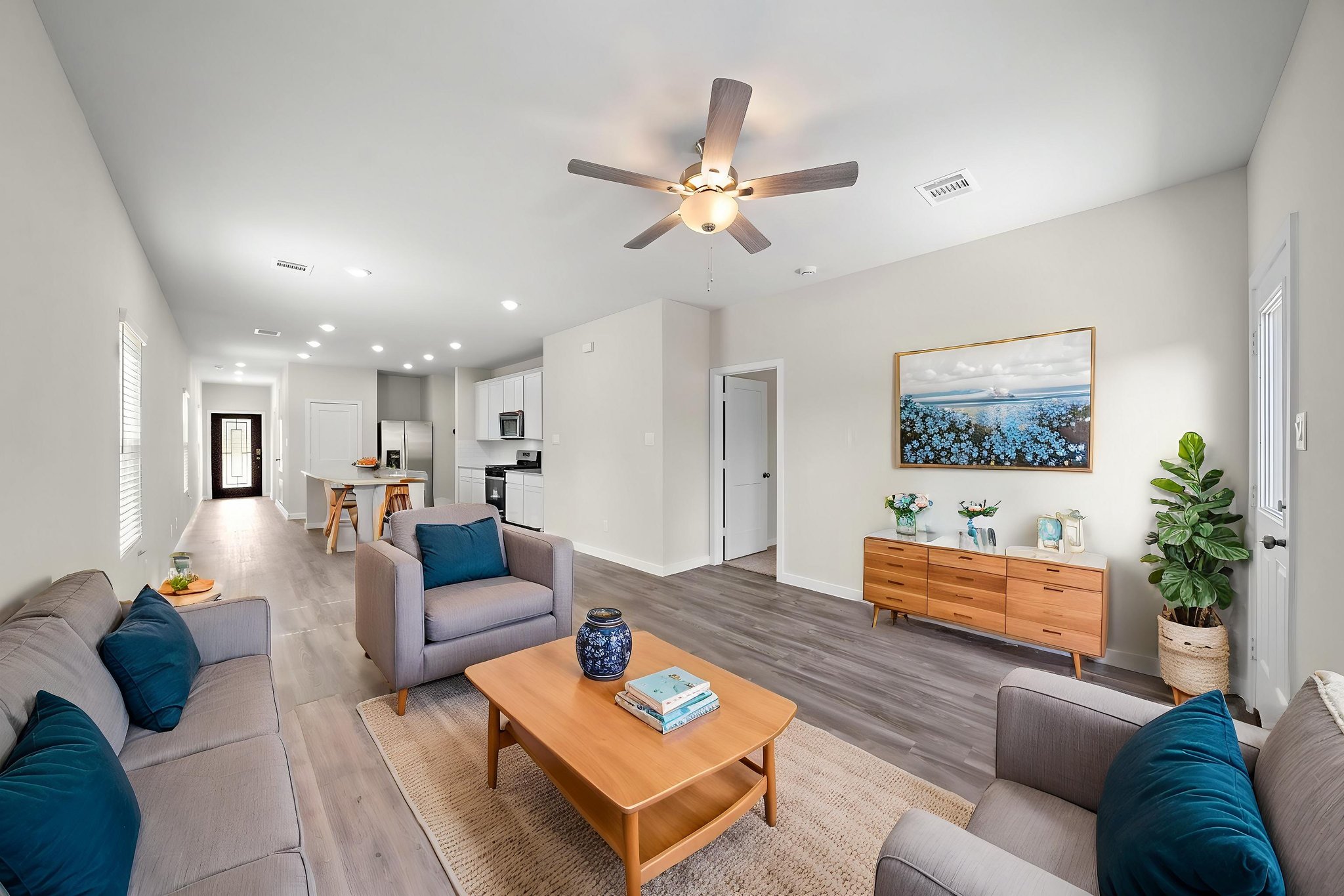 A living room with a ceiling fan.