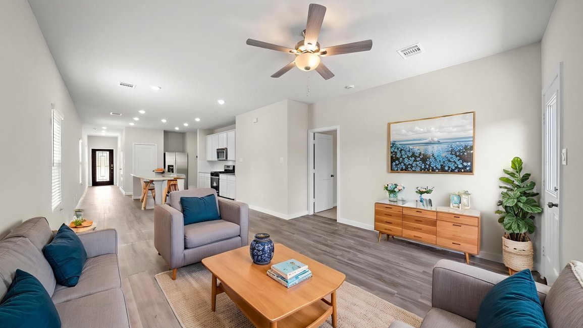 A living room with a ceiling fan.
