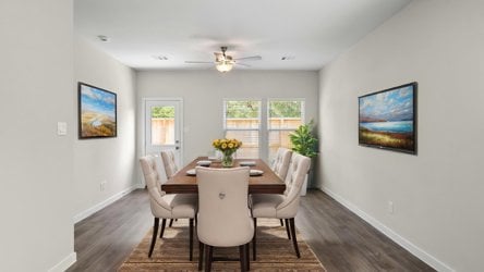 A dining room table with chairs.