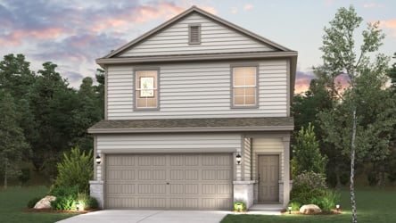 A house with a garage and trees around it.