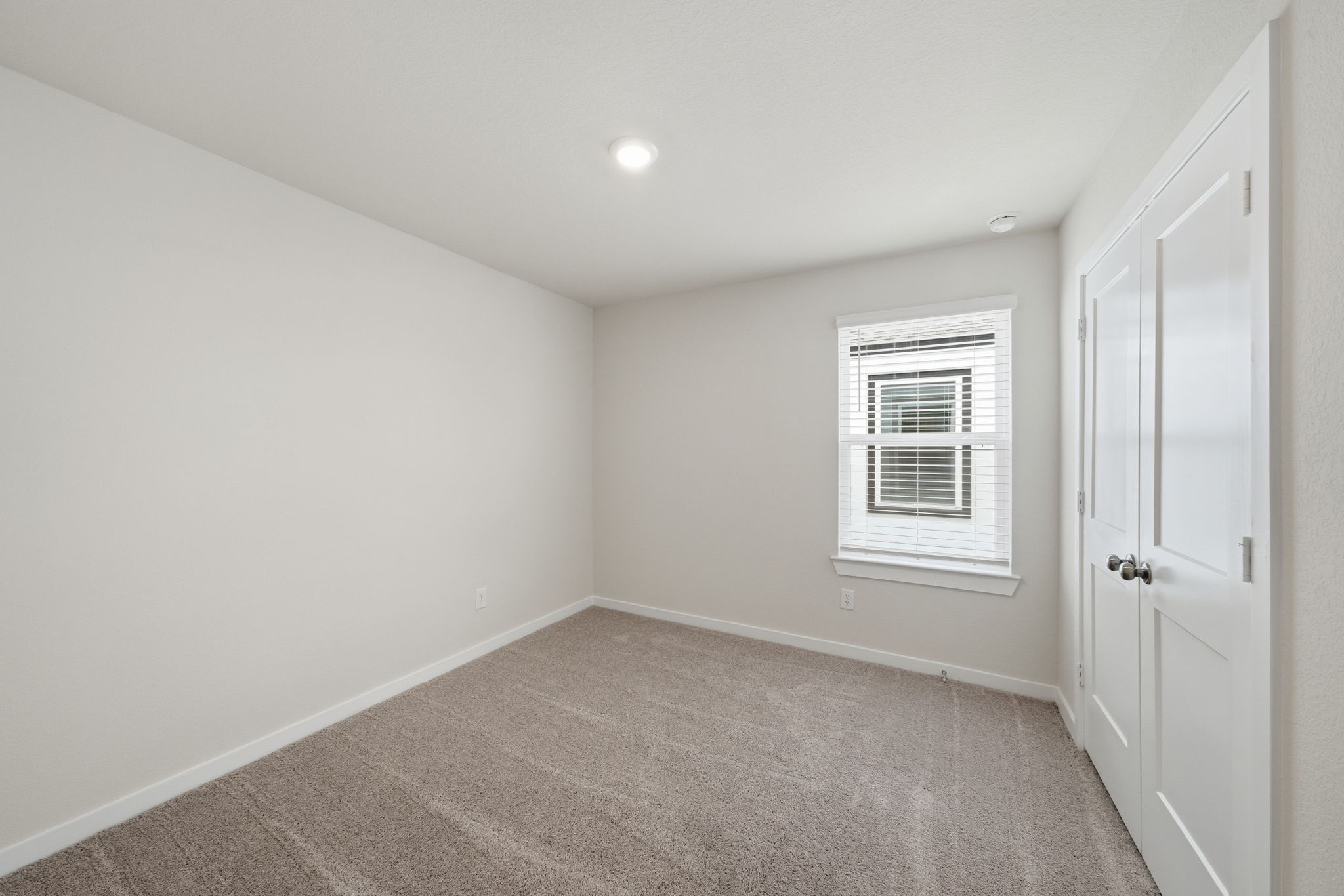 A room with a door and a window.