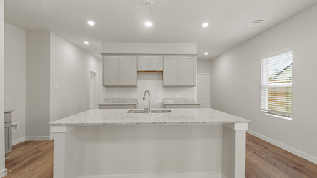 A kitchen with a marble countertop.