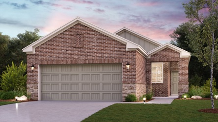 A brick house with a driveway.