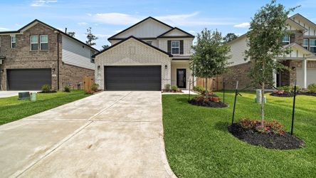 A driveway leading to a house.