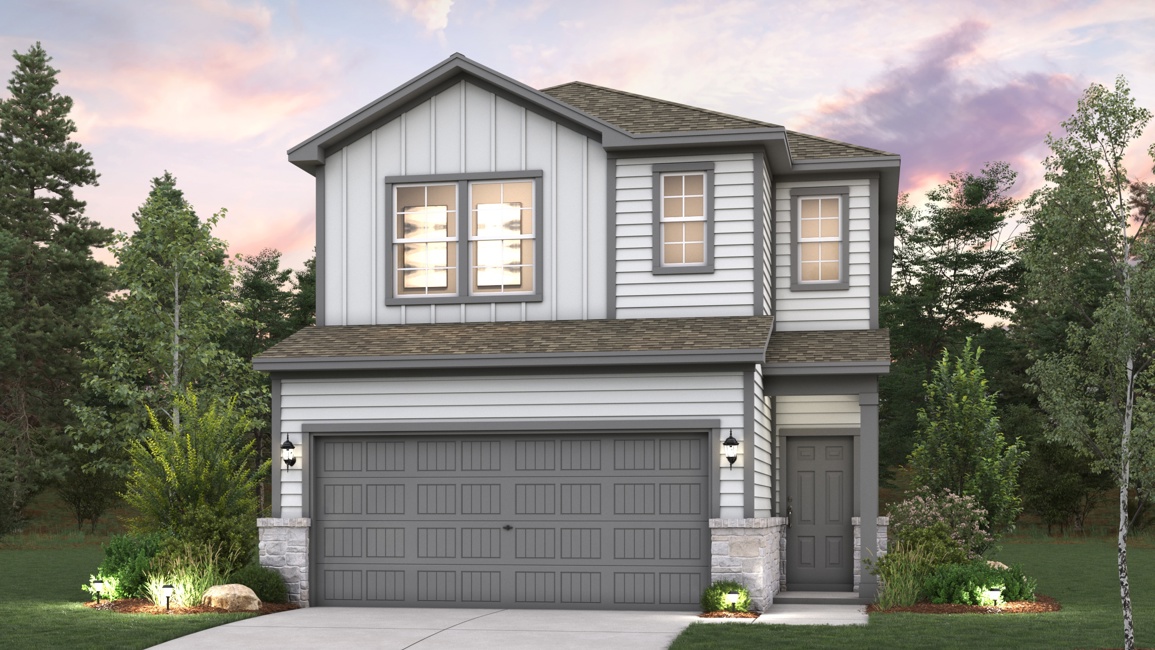 A house with a garage and trees around it.
