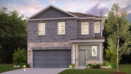 A house with a garage and trees.