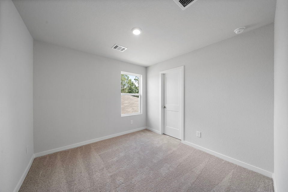 A room with a door and a window.