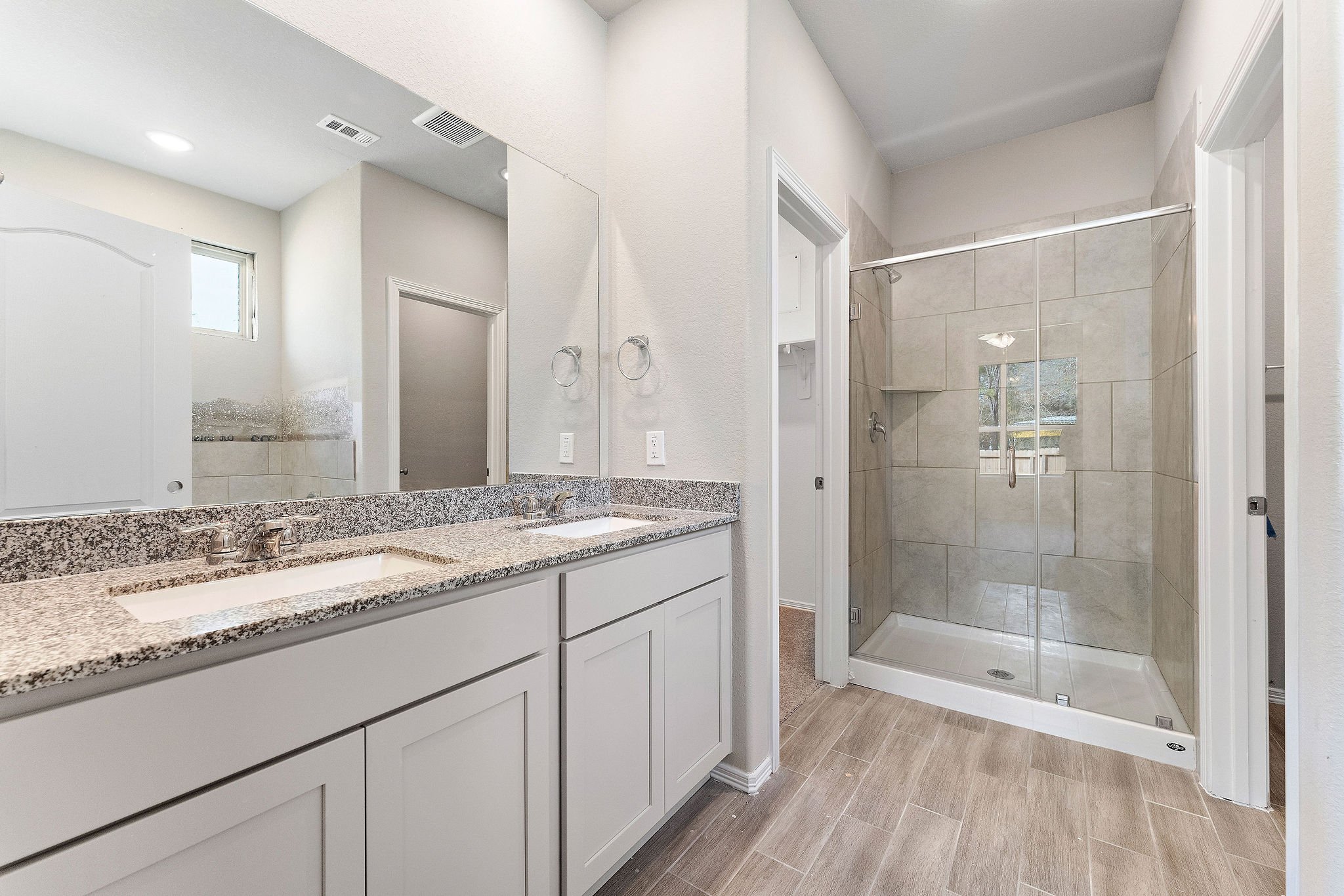 A bathroom with a marble countertop.