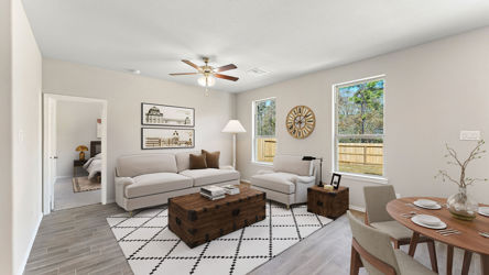 A living room with a couch and a table.