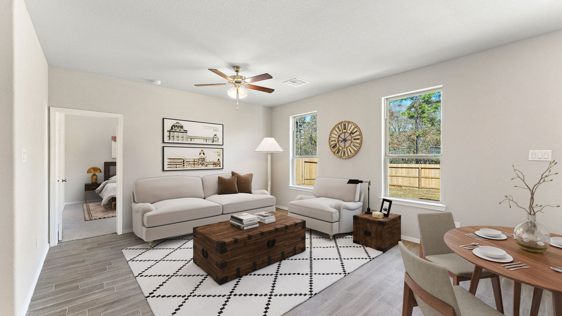 A living room with a couch and a table.