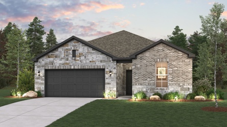 A house with a garage and a lawn in front of it.