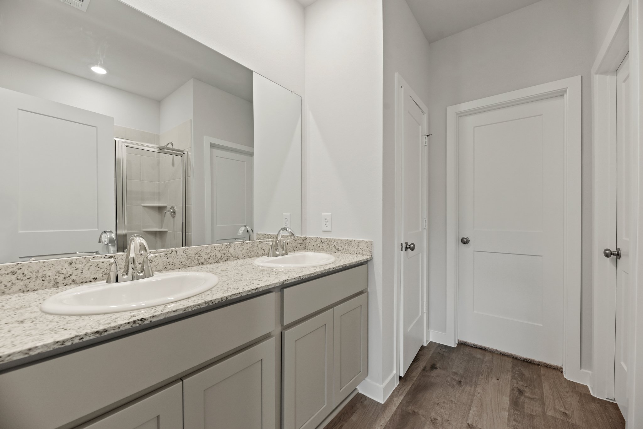 A bathroom with a marble countertop.