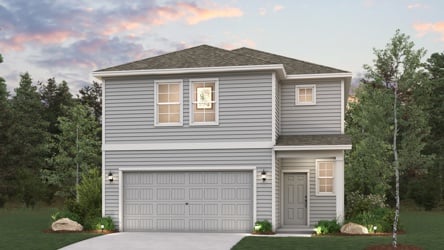A house with a garage and trees.