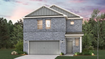 A house with a garage and trees.