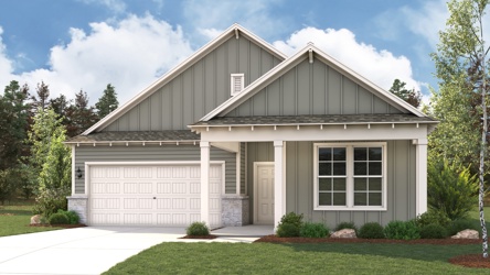 A house with a garage with American Gothic House in the background.