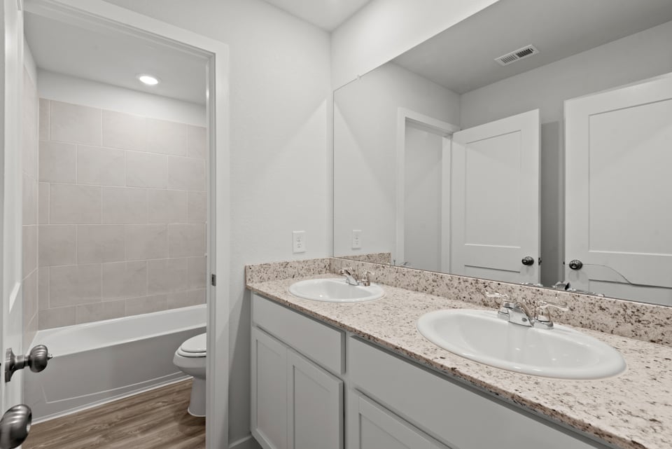 A bathroom with a sink and a tub.