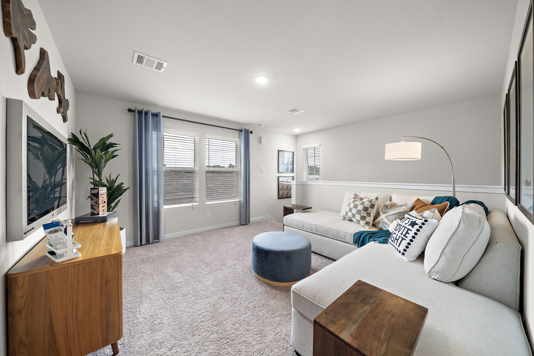 A living room with a couch and a tv.