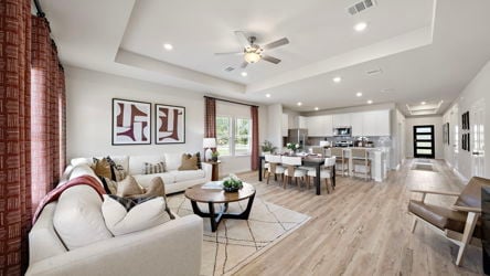 A living room with a wood floor.