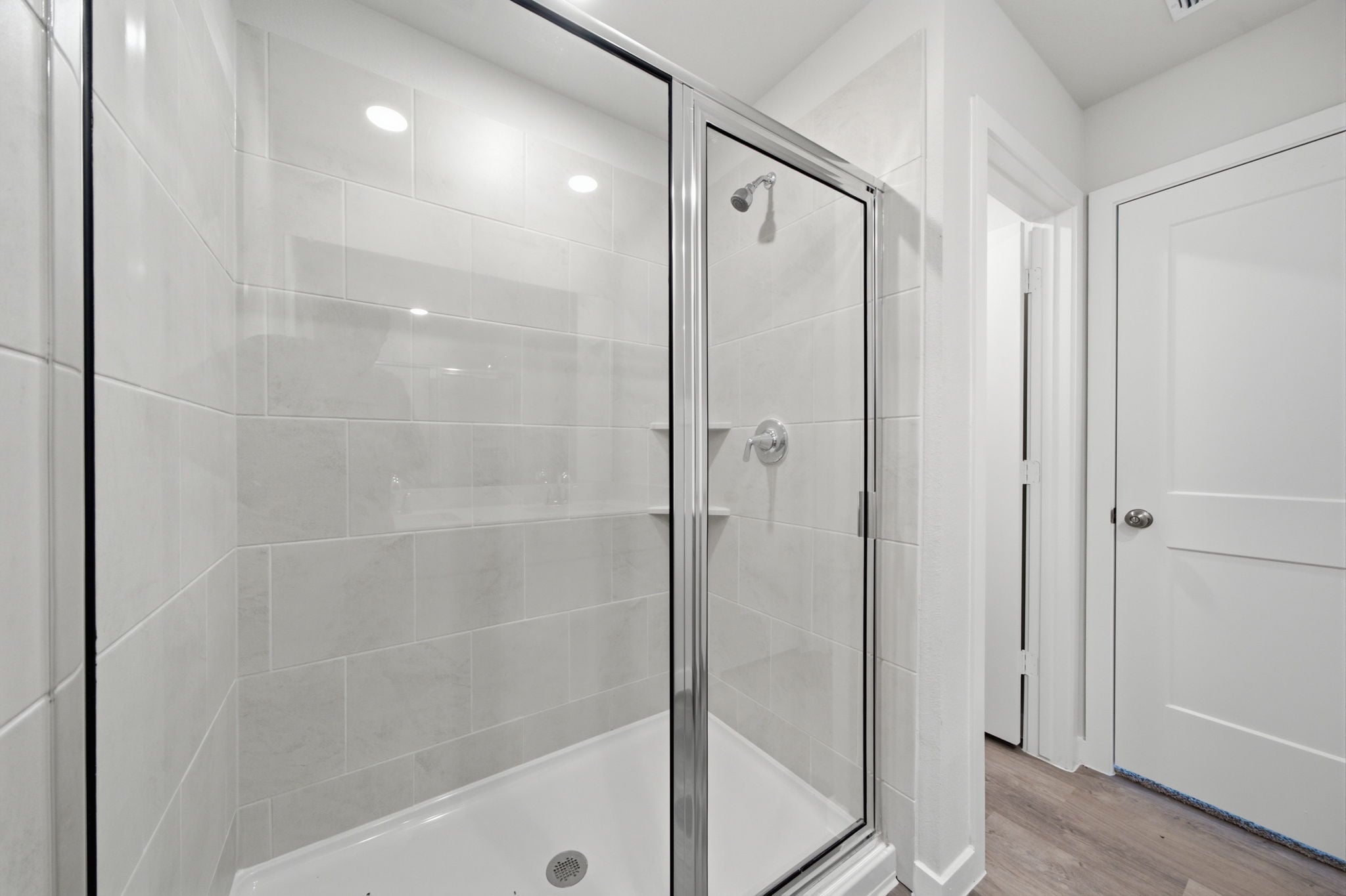 A bathroom with a glass shower.
