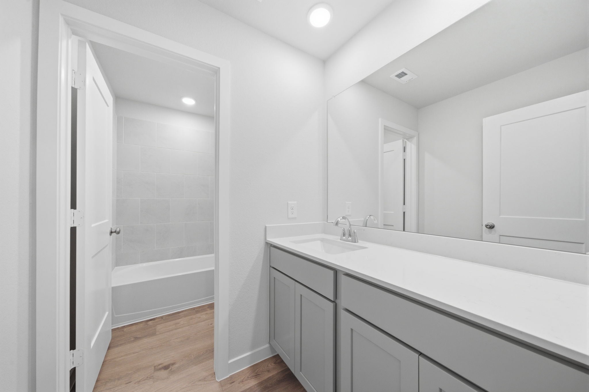 A bathroom with a sink and a bathtub.