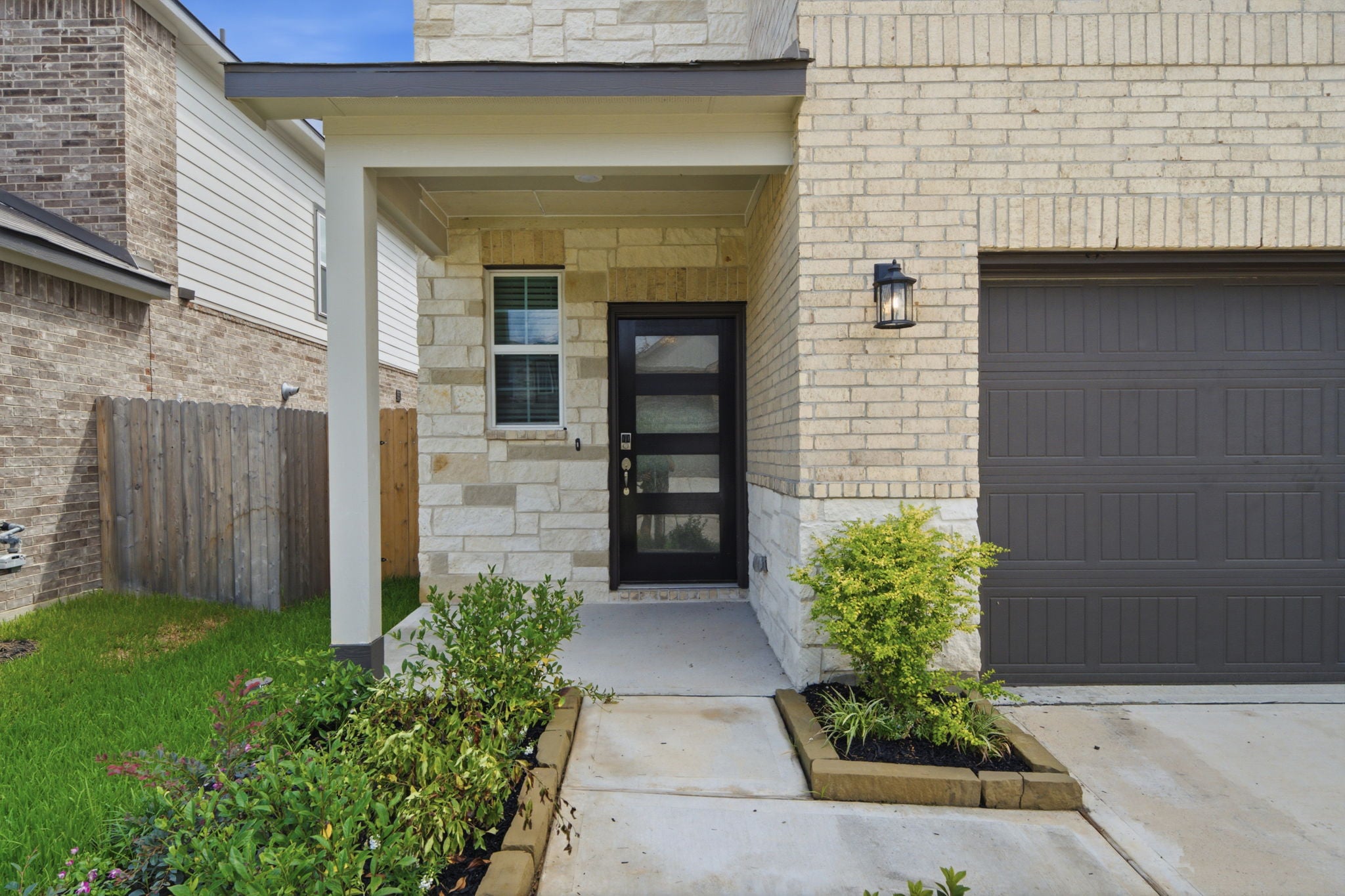 A house with a garage and a door.