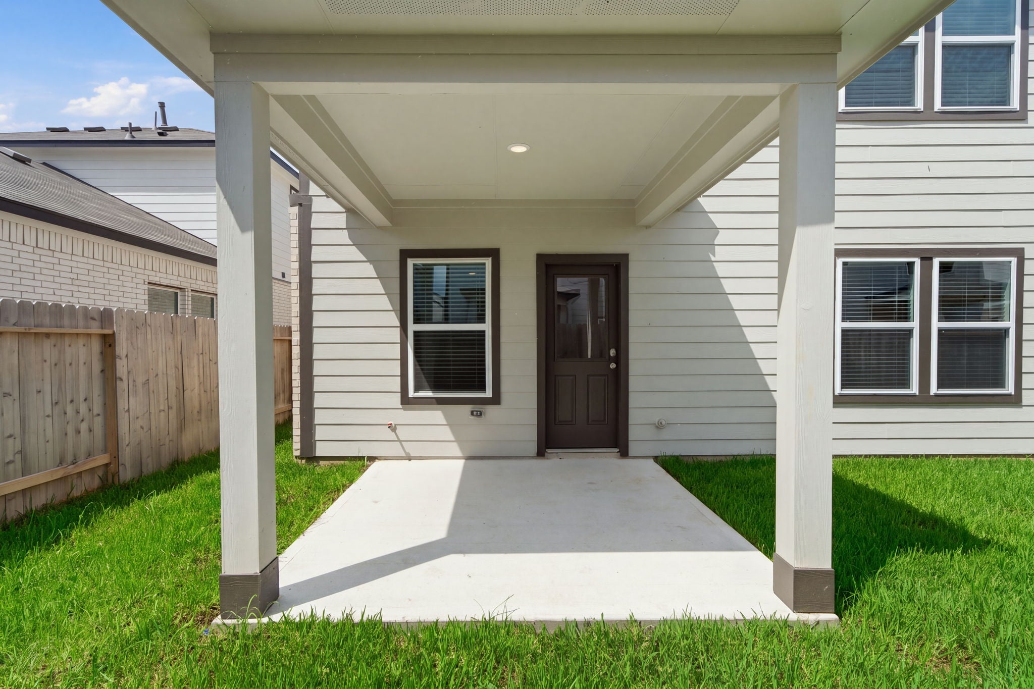 A house with a fence and a door.