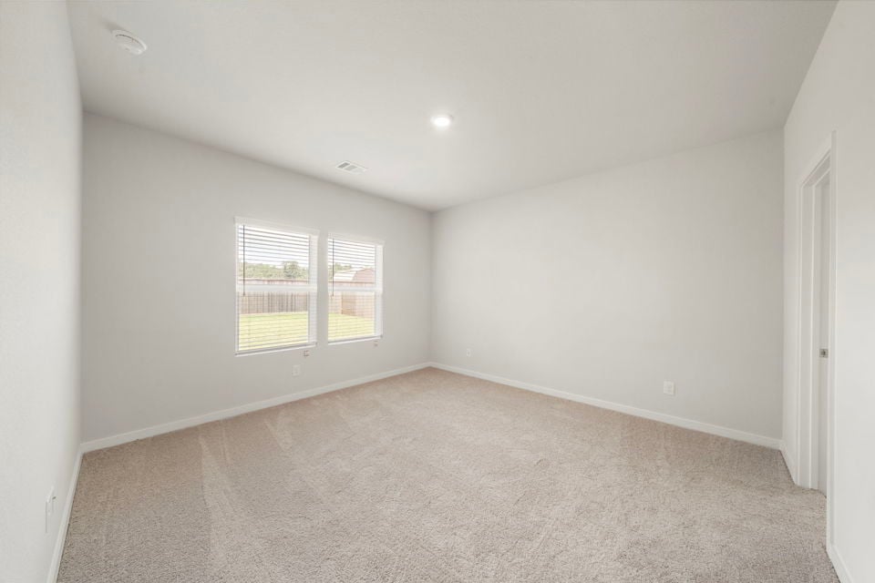 A room with a window and a door.