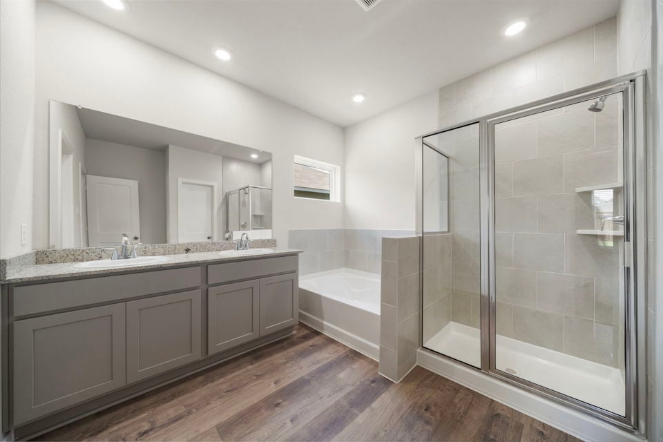 A bathroom with a glass shower.