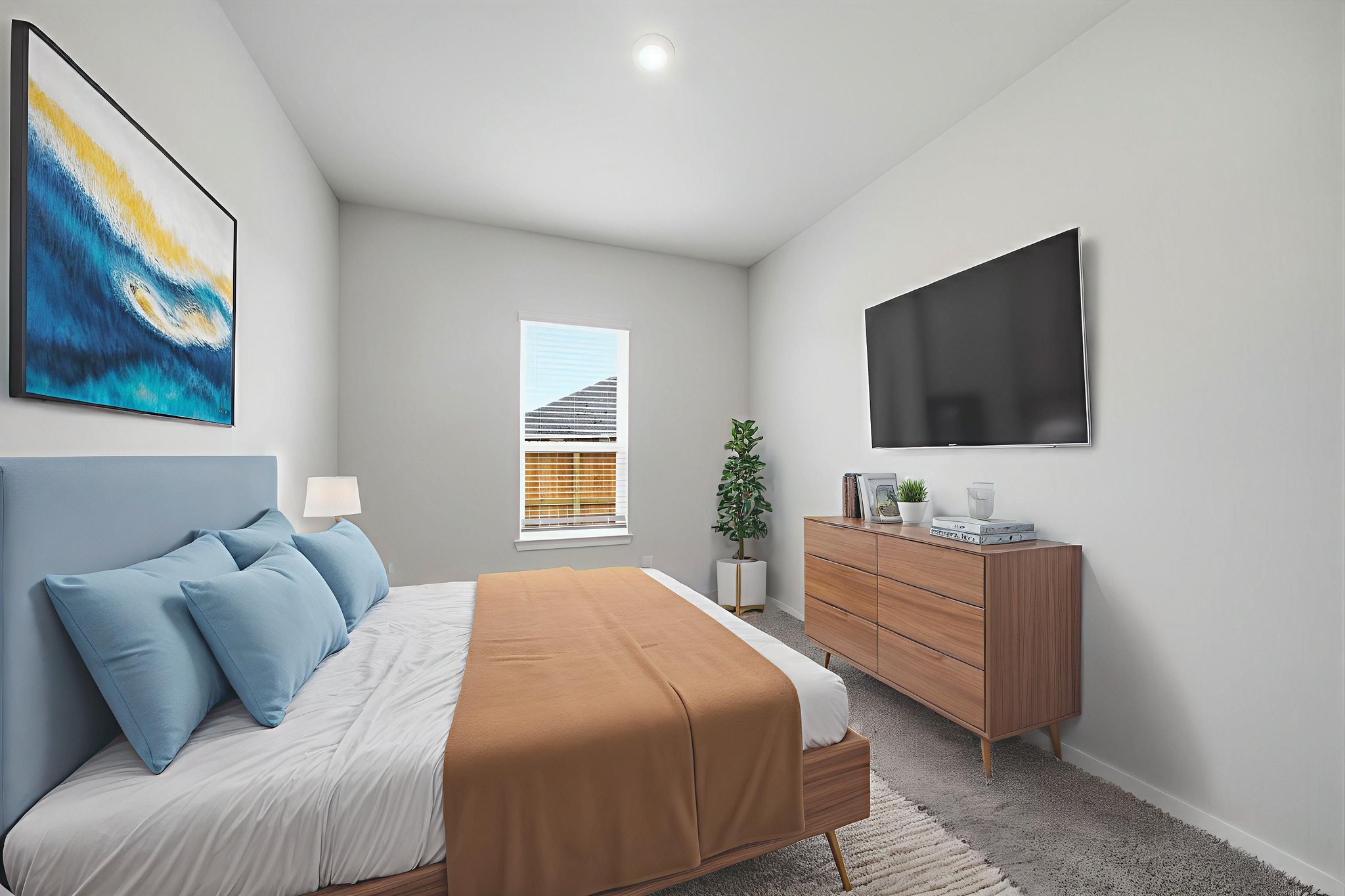 A bedroom with a bed and a tv.