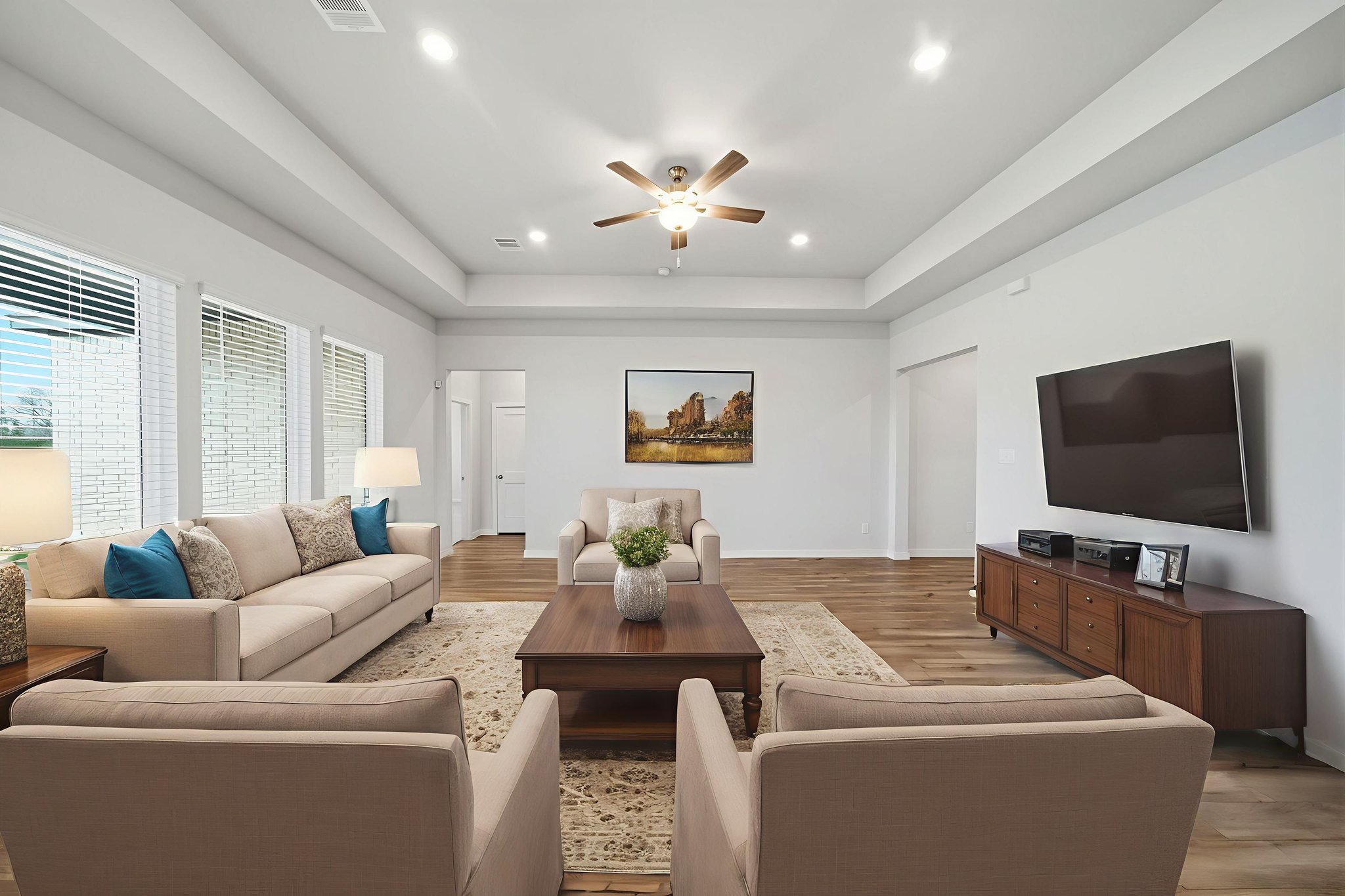 A living room with a tv and couches.
