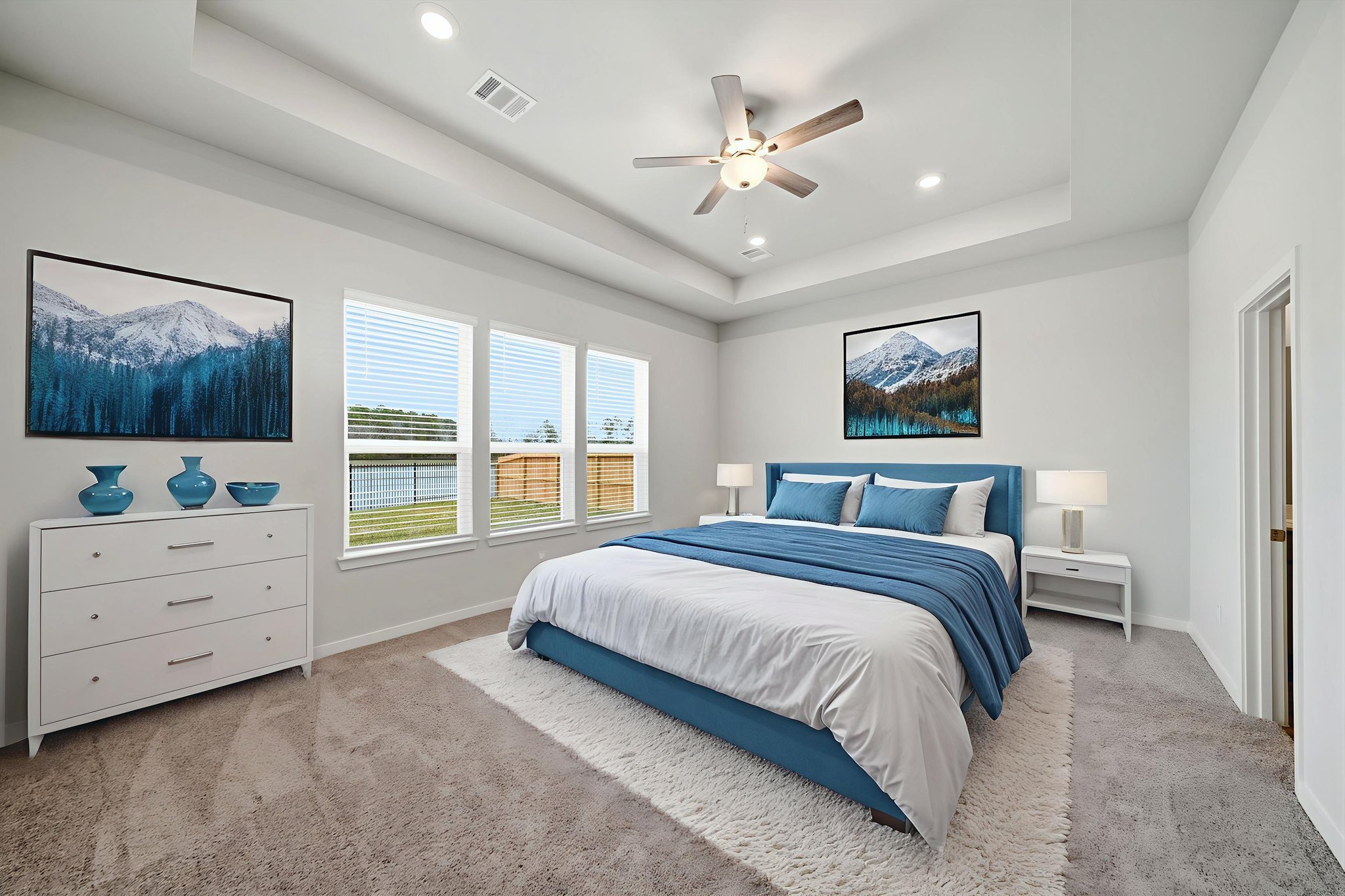 A bedroom with a large bed.