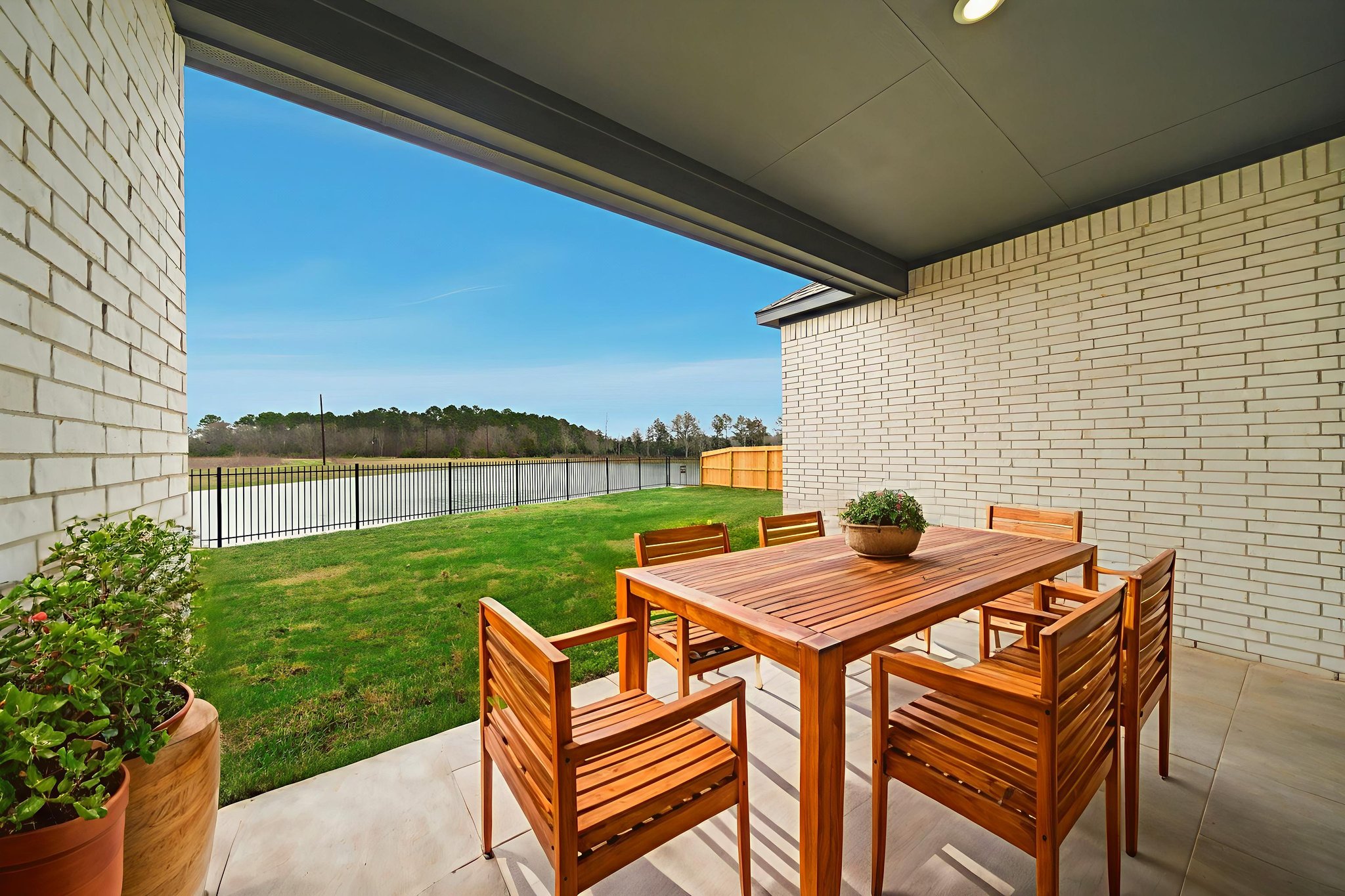 A table and chairs on a deck.