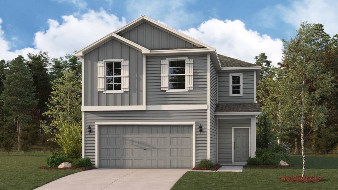 A house with a garage and trees.