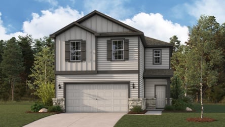 A house with a garage and trees.