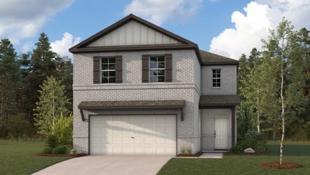 A house with a garage and trees.
