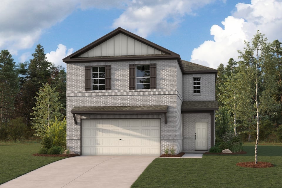 A house with a garage and trees.