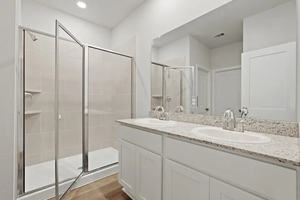 A bathroom with a glass shower.