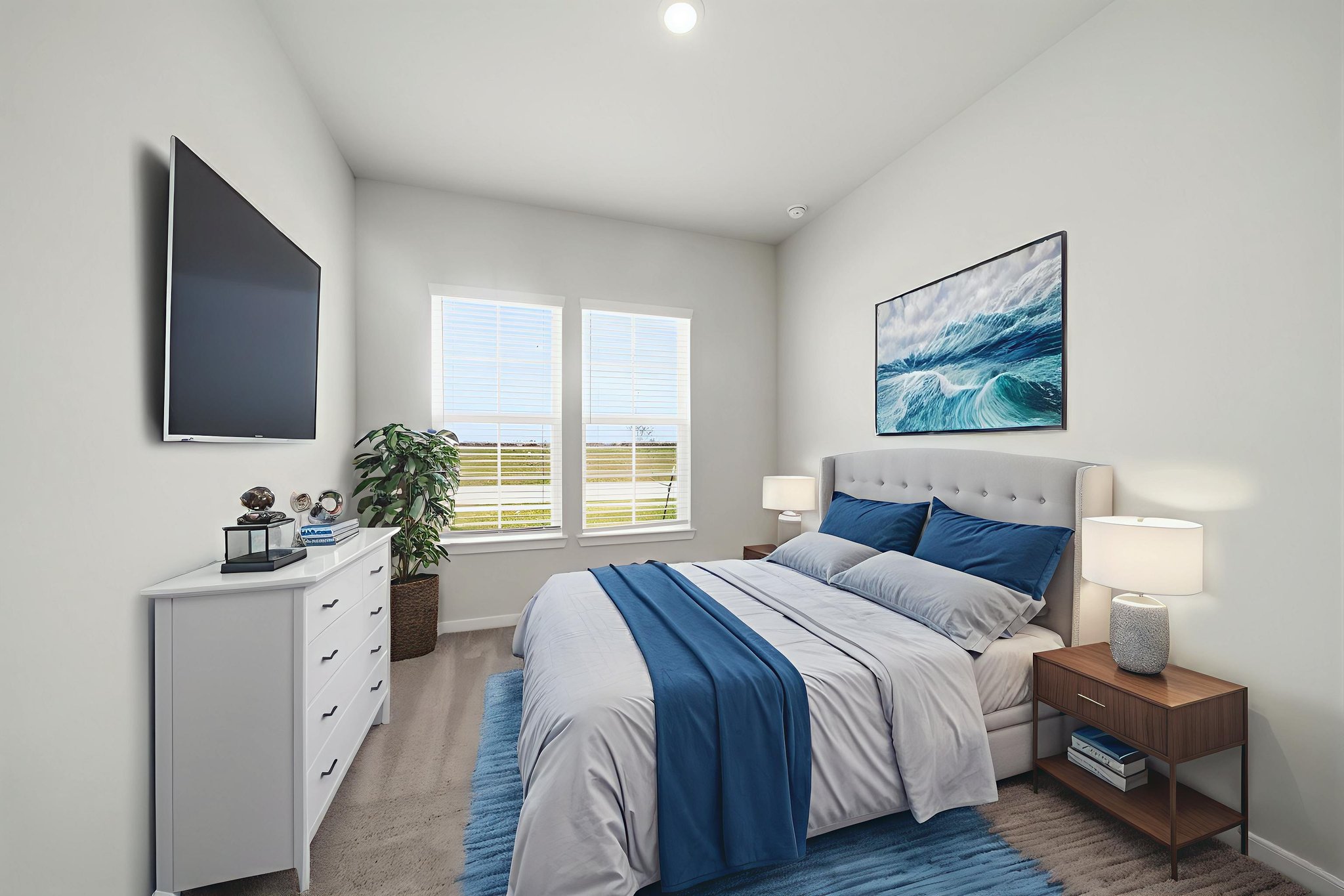 A bedroom with a bed and a tv.