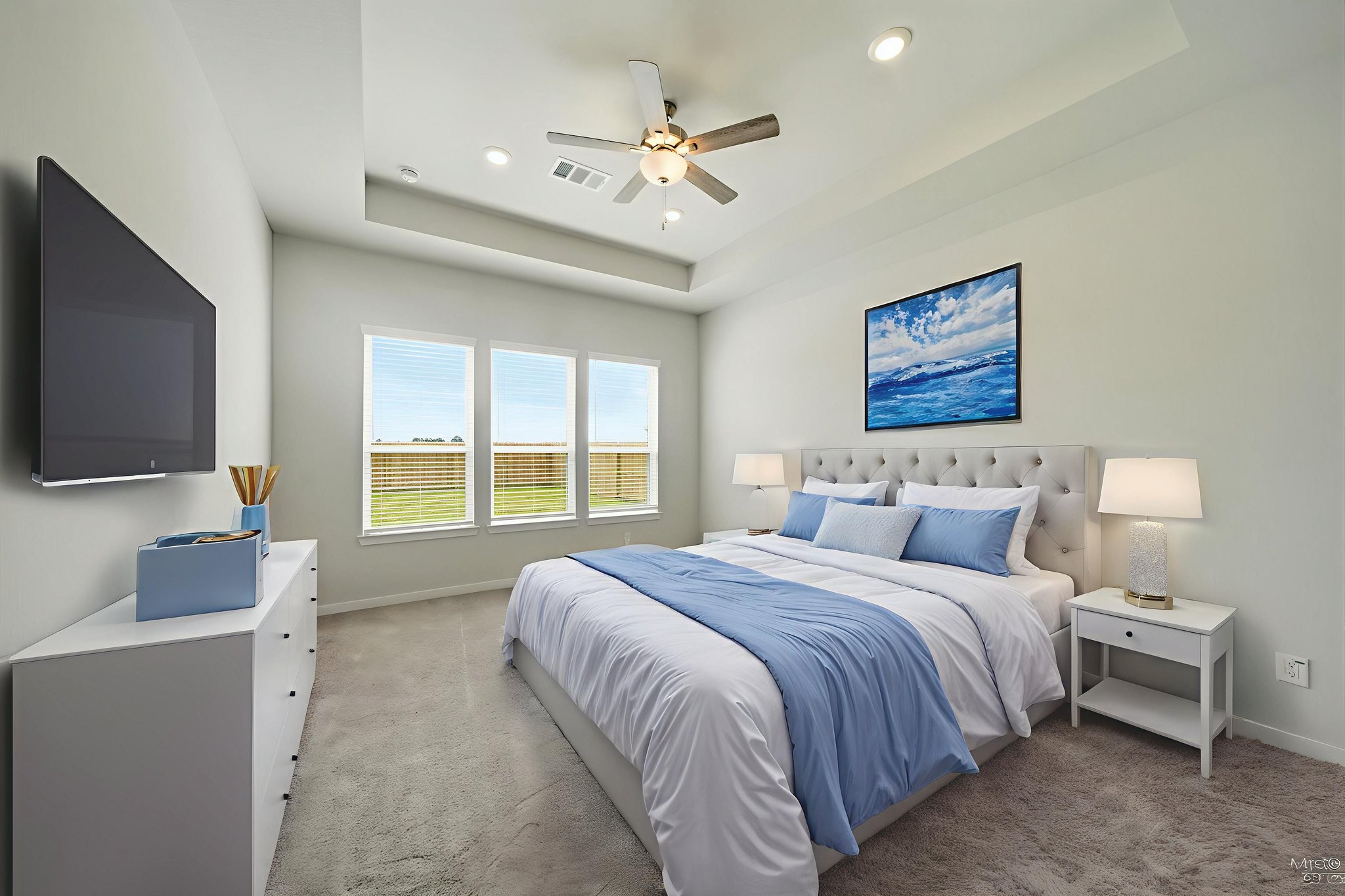 A bedroom with a bed and a television.
