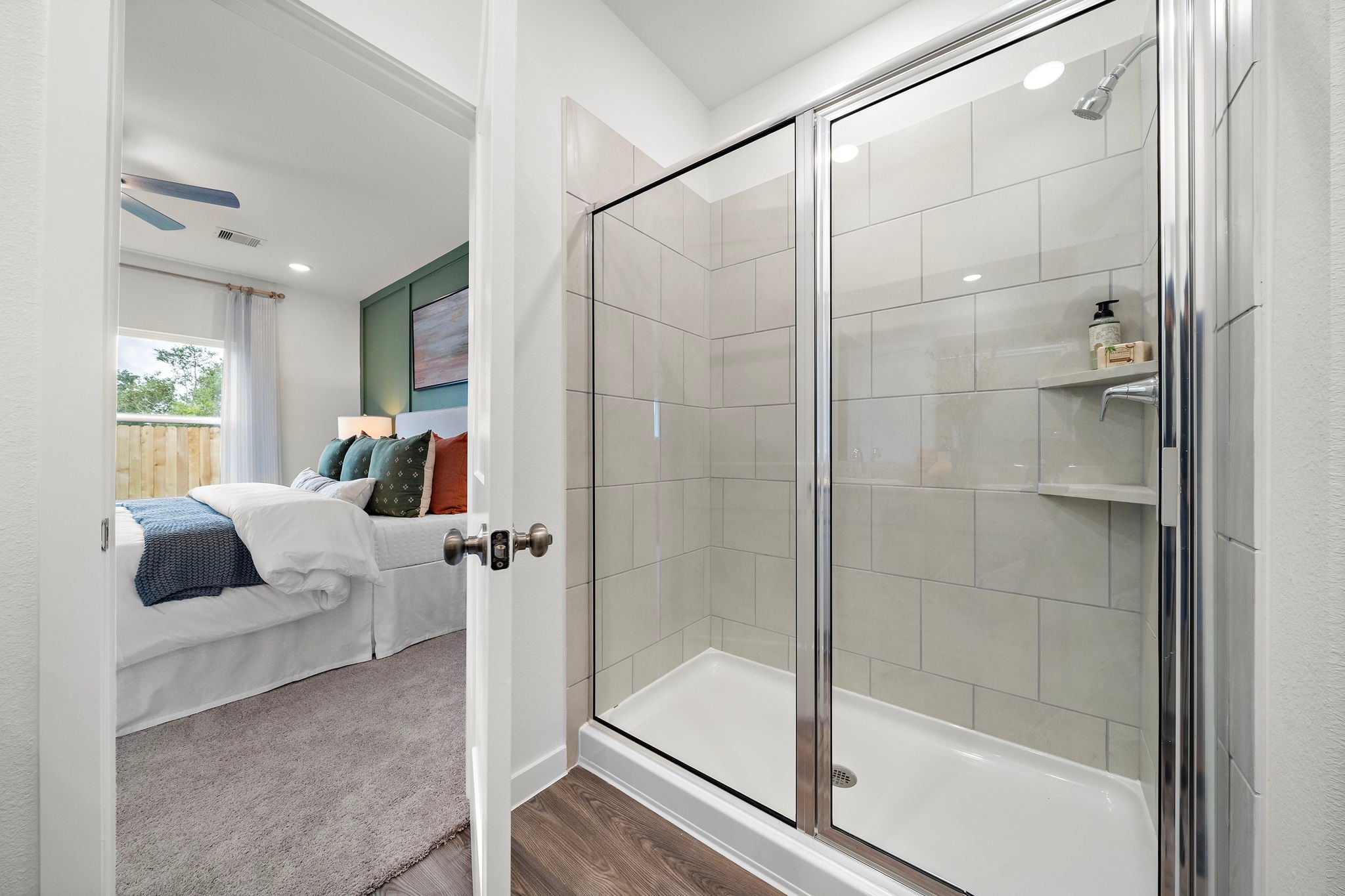 A bathroom with a glass shower.