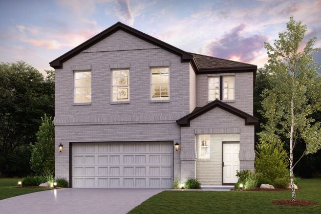 A house with a garage and trees.