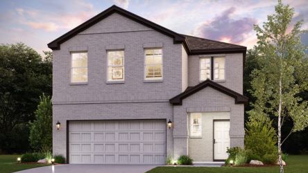 A house with a garage and trees.