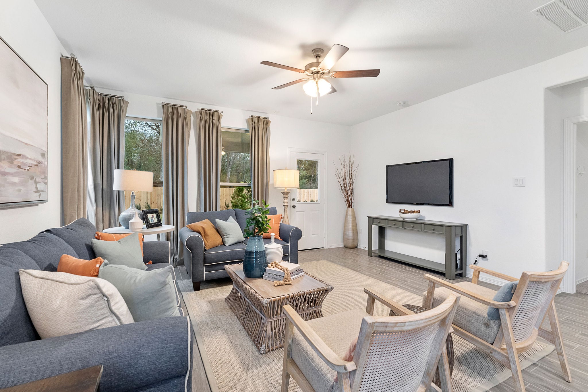 A living room with a tv and couches.