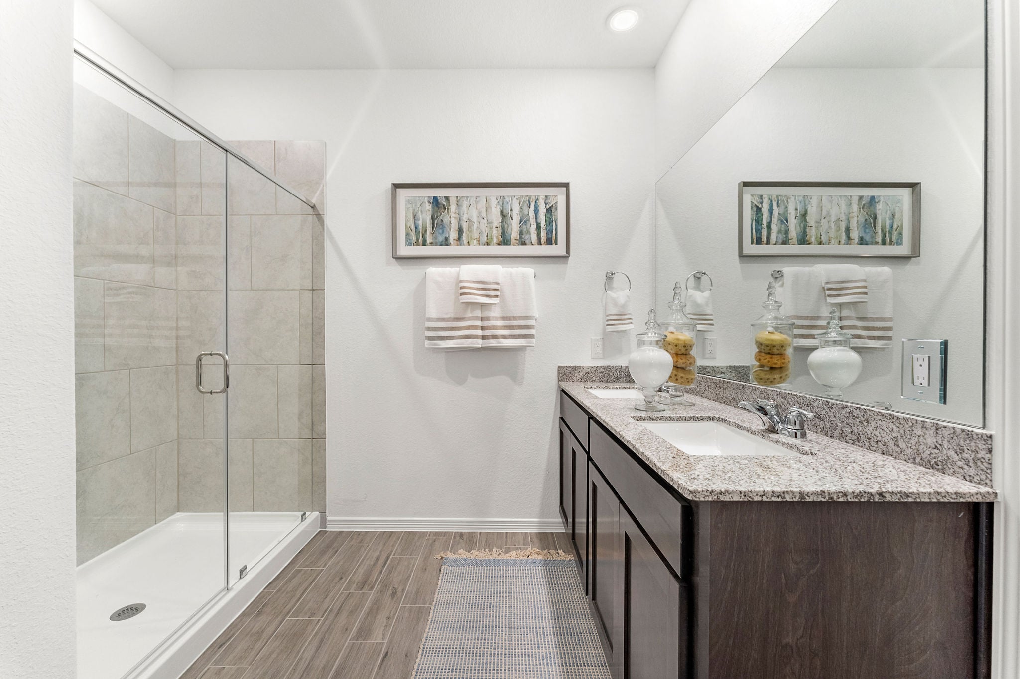 A bathroom with a glass shower.