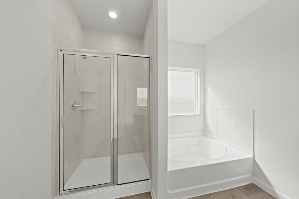 A bathroom with a glass shower.