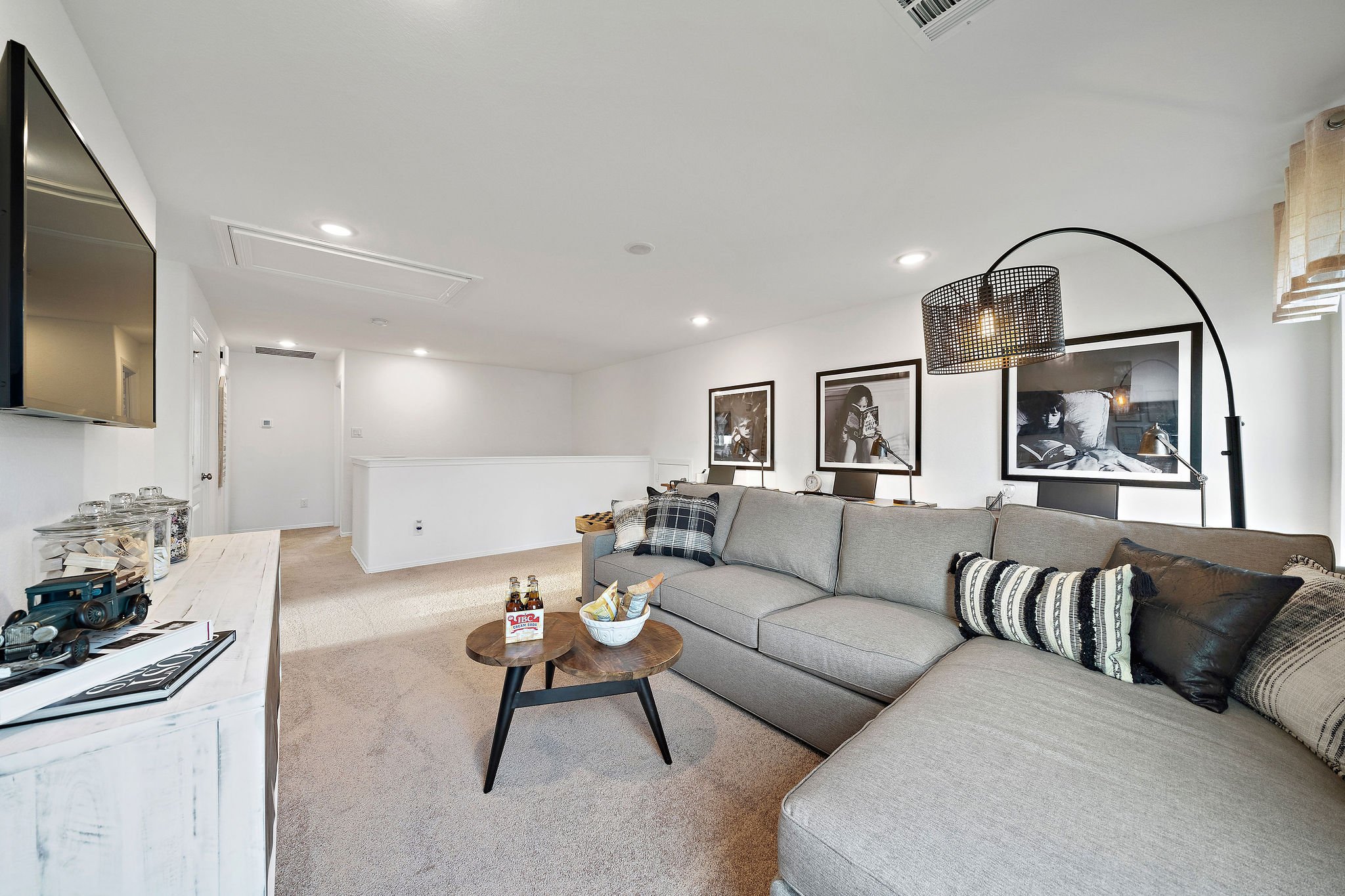 A living room with a couch and a table.